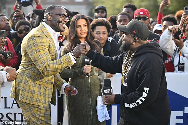 Sharpe pictured with First Take host Molly Qerim (center) at a First Take event in Atlanta