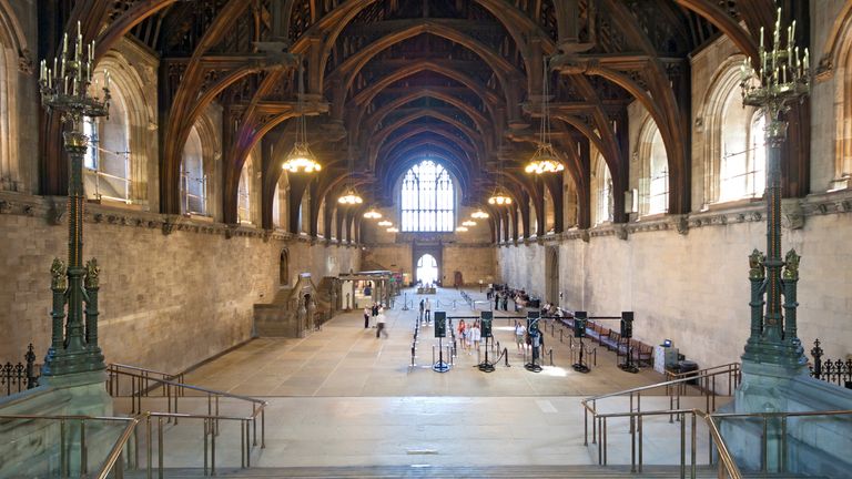 London, UK - 24 July 2010: Tourists queuing in Westminster Hall for a tour of the Houses of Parliament, which are offered when Parliament is in recession. Westminster Hall is the only surviving medieval part of the Houses of Parliament and has a famous wooden ceiling.