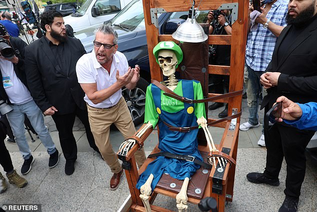 Artist Scott LoBaido's turned up outside court with a graphic protest at the government's decision to seek the death penalty