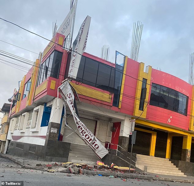 The signs of a pharmacy were destroyed after a magnitude 6.3 earthquake rattled Esmeraldas, a city on the northwestern coast of Ecuador, on Friday mornign