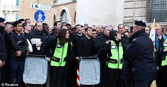 People wait to enter the Vatican, ahead of the funeral Mass of Pope Francis in St. Peter's Square, as seen from Rome, Italy, April 26, 2025. REUTERS/Kevin Coombs