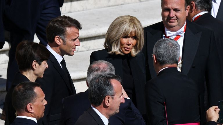 President Macron was accompanied by his wife Brigitte. Pic: Reuters