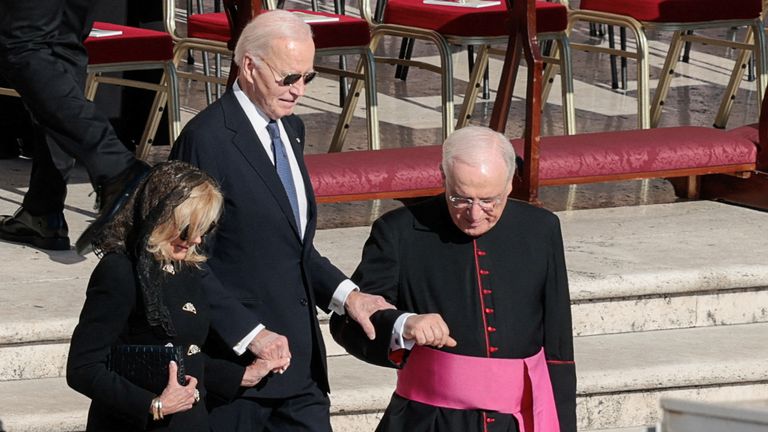 Former US president Joe Biden and his wife Jill arrive for the ceremony