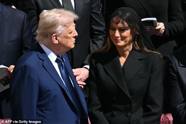 Melania shot a sweet smile towards her husband during the service in St Peter's Square