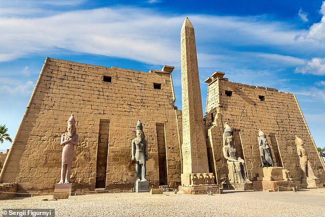 The obelisk in Paris is actually one of two known as the Obélisques de Louxor, each carved from a single piece of red granite over 3,000 years ago. One remains in position outside of Egypt's Luxor Temple (pictured)