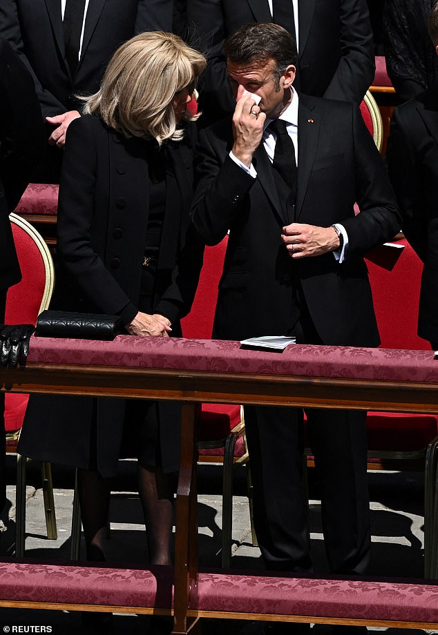 A teary Emmanuel Macron and his wife Brigitte Macron among the guests