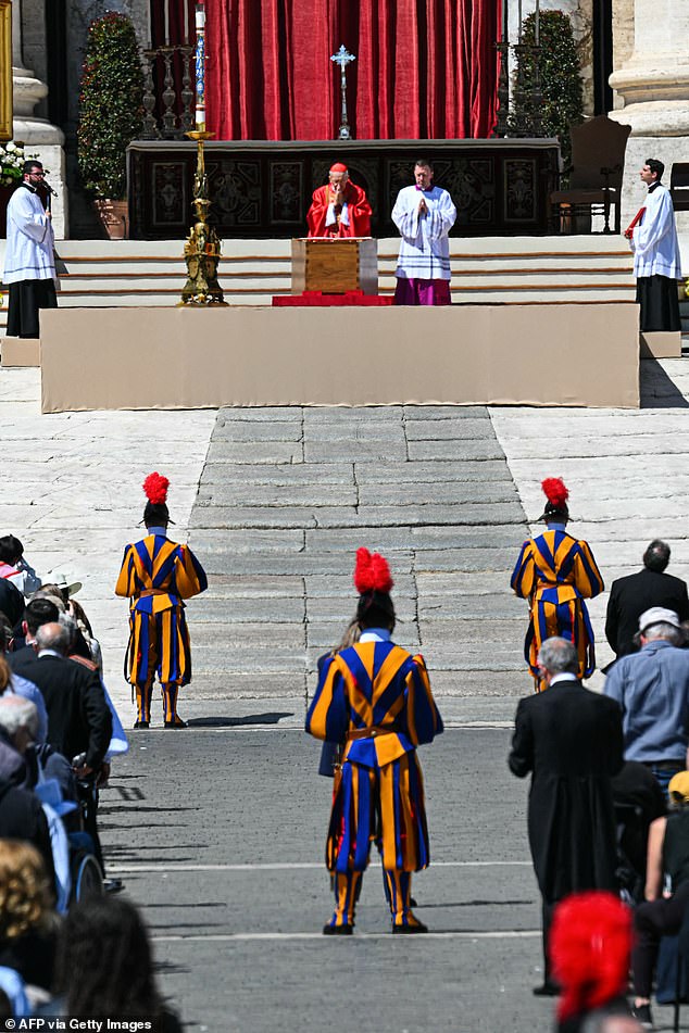 Italian cardinal Giovanni Battista Re (L) officiates near the coffin of late Pope Francis during the funeral ceremony at St Peter's Square