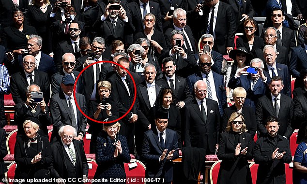 Among those capturing a sneaky shot of the Pope's coffin was Switzerland's president, Karin Keller-Sutte