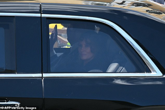 Donald Trump (back) waves as he leaves with US First Lady Melania Trump after attending Pope Francis' funeral ceremony, in Rome on April 26, 2025