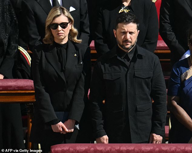 Volodymyr Zelensky (C) and his wife Olena Zelenska (L) stand alongside other leaders