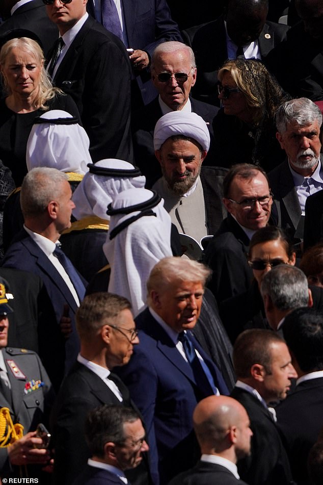 At one point during the service, Biden was seen staring at the back of Trump's head from several rows back, while the man who usurped him in the White House conversed with world leaders