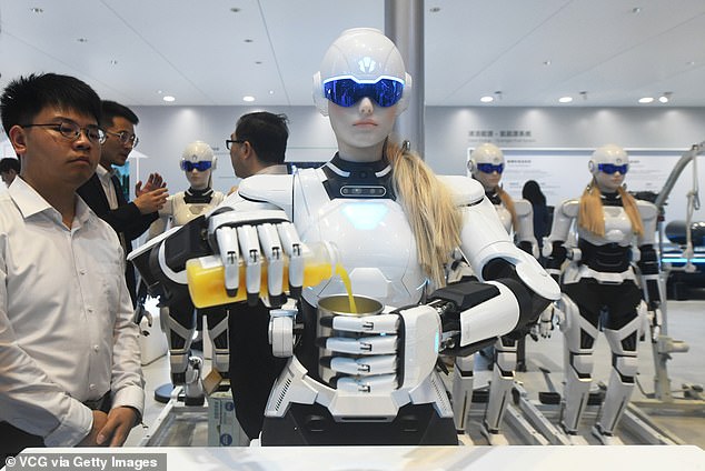 Pictured: A humanoid AI-powered robot developed by a Chinese car company that's capable of pouring drinks and conversing with people