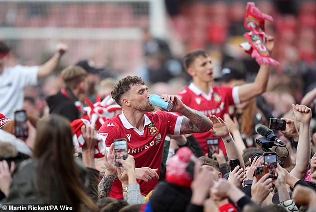Wrexham players were able to toast their hard fought promotion to the second tier