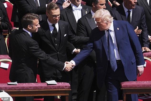 They did properly shake hands during the mass service at the funeral, where they were seated nearby each other