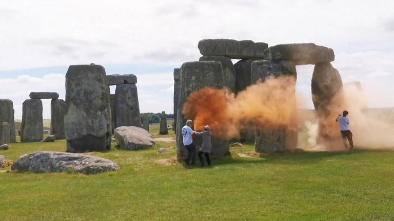 Orange smoke set off by JSO protesters at Stonehenge