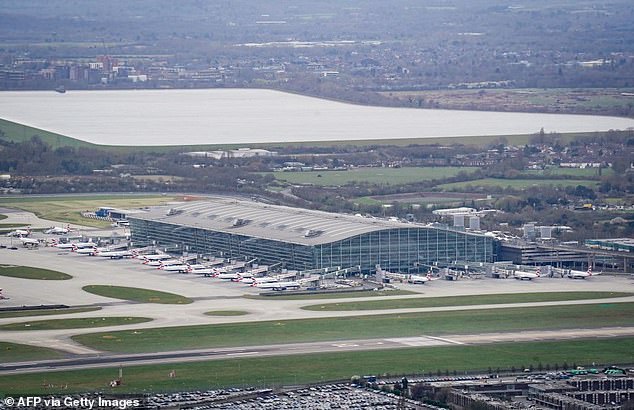 The flight departed from Boston at 8:45 pm and is scheduled to land in London's Heathrow Airport (pictured) at 6:15 am GMT (file photo)