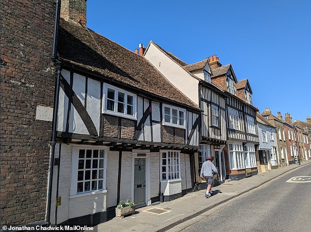 Magic Editor, an AI-powered photo editing tool, makes complex edits like repositioning subjects and removing unwanted elements. It makes more drastic changes compared with Magic Eraser. This unedited image taken with Pixel 9a shows a historic street in Kent