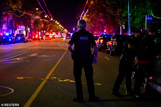 Police work on Fraser street, near the site of the Lapu Lapu day block party -- April 26, 2025