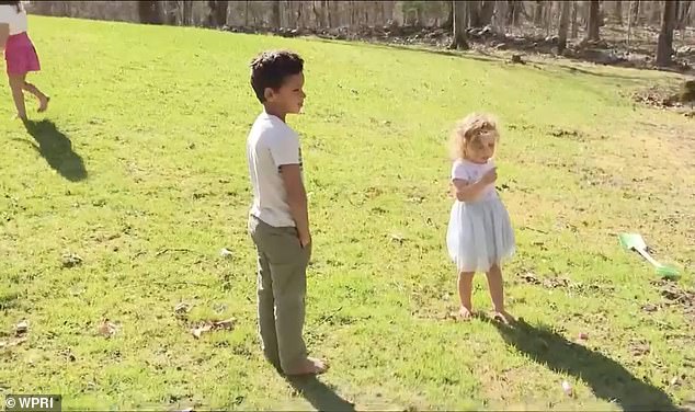 Malachi is seen playing with his two sisters - well away from the trees!