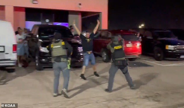 The side doors of the nightclub then swung open as a herd of people, both men and women, ran out frantically
