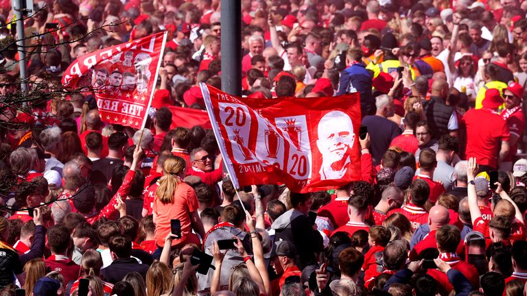 Flags fly at Anfield on Sunday. Pic: PA