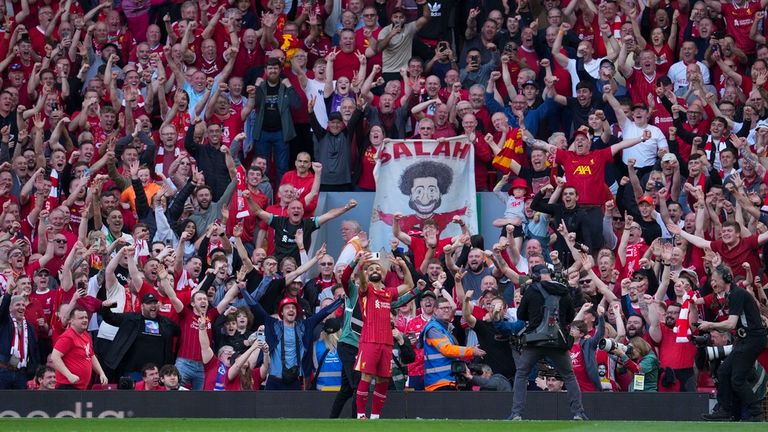 Mohamed Salah takes a selfie with fans after scouring the fourth Liverpool goal. Pic: AP