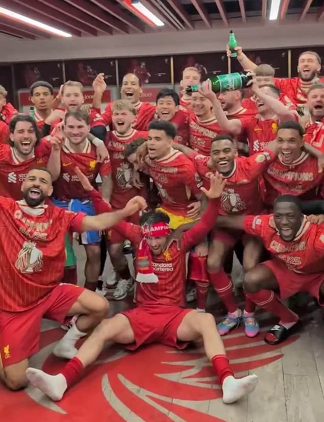 The squad posed for a group shot as the festivities continued long into the night at Anfield