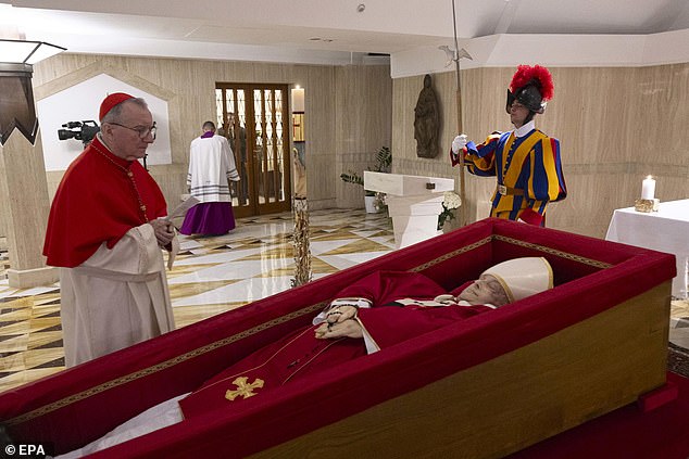 Cardinal Parolin, pictured visiting the body of Pope Francis, worked closely with the late Pope and could be a compromise candidate between the conservative and reformist camps