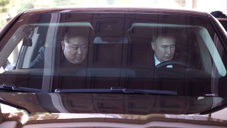 Vladimir Putin and North Korea's leader Kim Jong Un ride an Aurus car in Pyongyang, North Korea.
Pic: Reuters