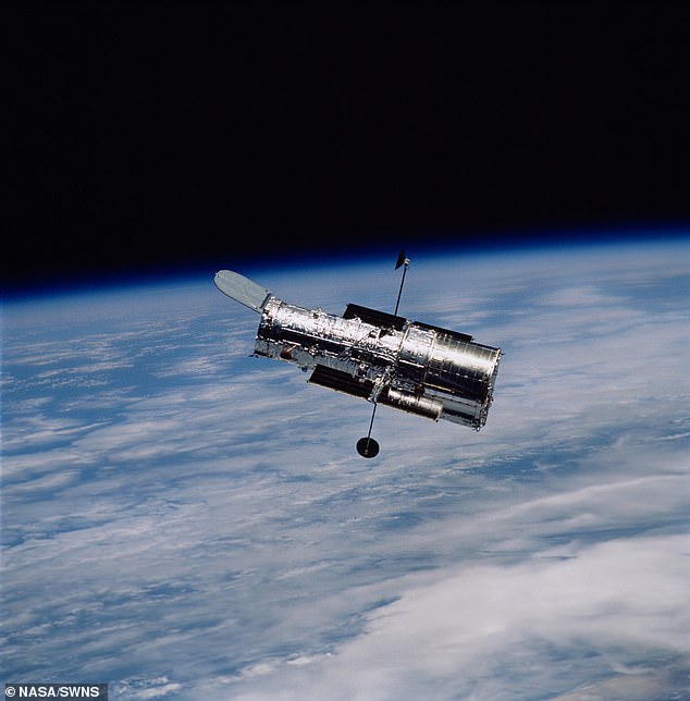 Using data from the Hubble Space Telescope (pictured) researchers were able to measure the subtle disturbances in spacetime caused by the passage of a lone black hole moving through a region of stars