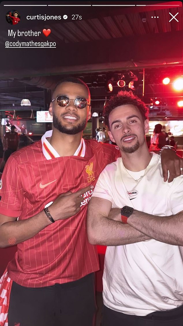 Cody Gakpo and Curtis Jones took in the moment after helping Liverpool to the Premier League