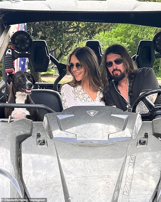 Another photo saw them driving around his property together in a buggy with one of his family dogs