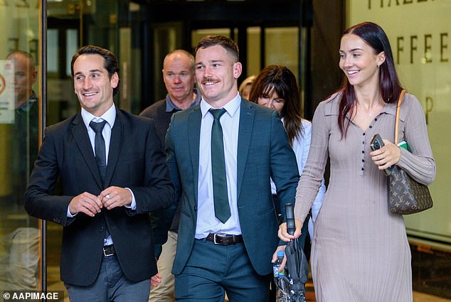A lawyer for the police officers said their response was proportional to the threat that NRL player (centre) had posed when he put his hand on the firearm of a third officer