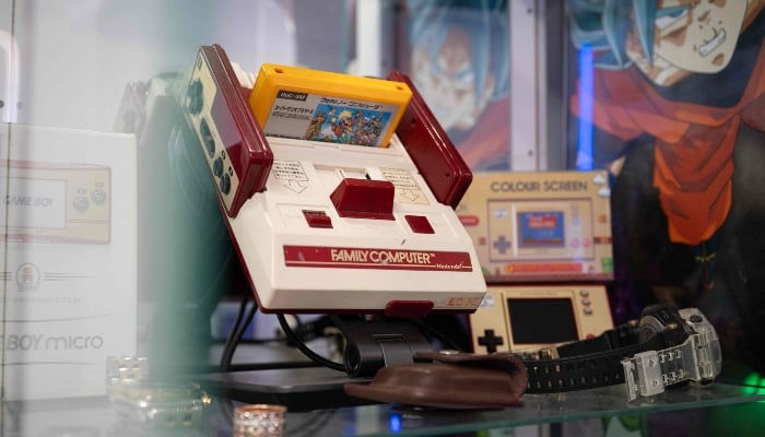 A retro ´Nintendo Family Computer´, sold in Japan as a forerunner to the Nintendo Entertainment System (NES), is displayed at the headquarters of RetroSix in Stoke-on-Trent, England, on April 1, 2025. —AFP