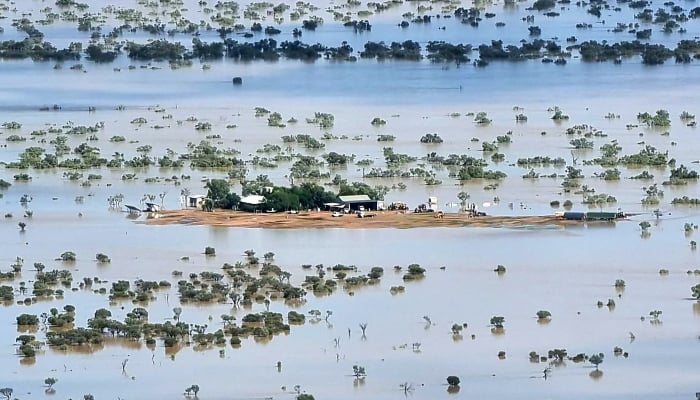 This handout photo taken on March 29, 2025 and released by The Queensland Fire Department shows a homestead under floodwaters near the town of Jundah in south-west Queensland, Australia. — AFP