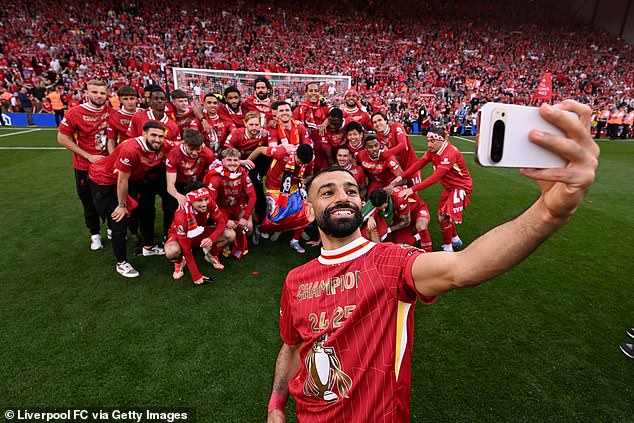 After the final whistle on Sunday, Salah was seen on photography duty once more, taking centre stage for a series of photos of the whole squad