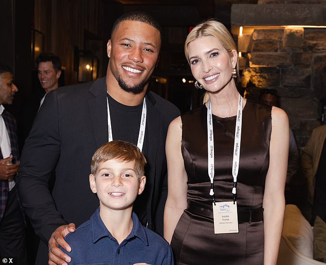 Saquon Barkley takes a photograph with Ivanka Trump and her 11-year-old son Joseph