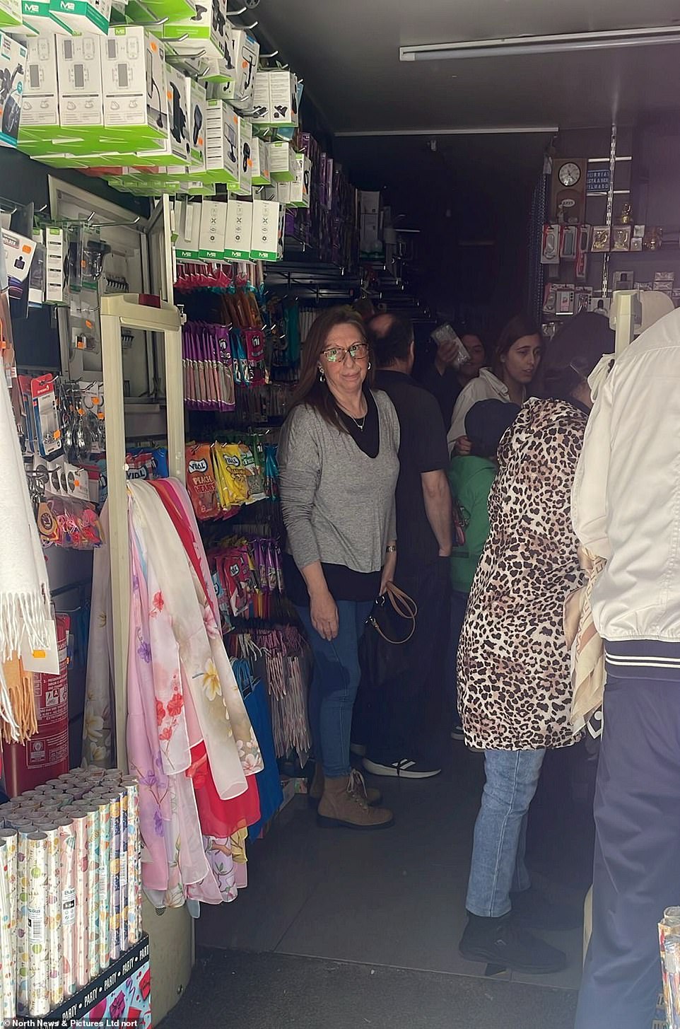 People queuing for candles in a shop Residents in Portugal and Spain have been hit with huge power cuts