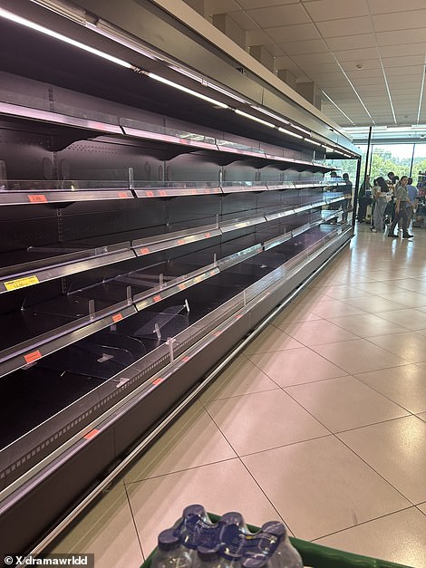Shelves were emptied in a supermarket in Portugal as electricity firms warned of days of disruption