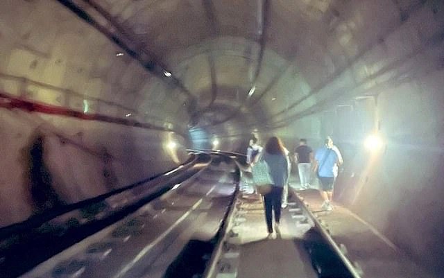 Pictures show people being evacuated from trains in Spain down tunnels amid the outage