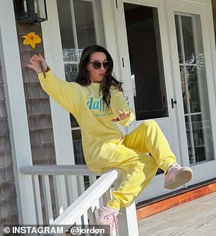 She posed in a yellow sweat suit set