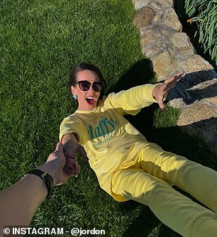 The former cheerleader kicked back in a pair of sunglasses