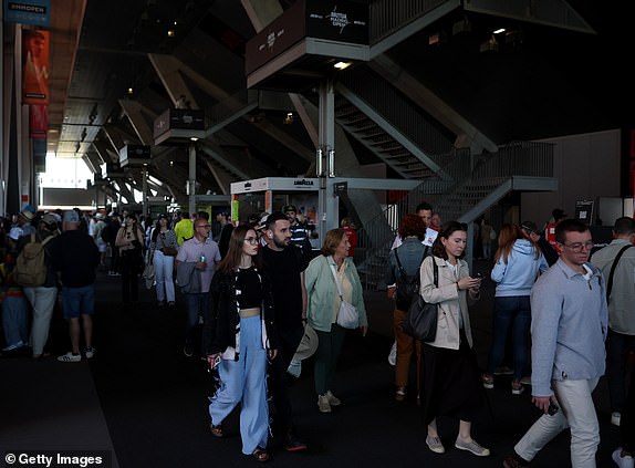 MADRID, SPAIN - APRIL 28: Fans walk through the dark gangways  during a general power blackout during Day Seven of the Mutua Madrid Open at La Caja Magica on April 28, 2025 in Madrid, Spain. A widespread power outage hit Spain, Portugal and parts of France. (Photo by Julian Finney/Getty Images)