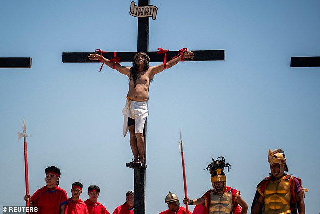 Some scientists believe that Jesus might have merely fainted on the cross and recovered while in the tomb. Pictured: An actor reenacts the crucifixion