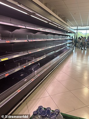Shelves were emptied in a supermarket in Portugal as electricity firms warned of days of disruption