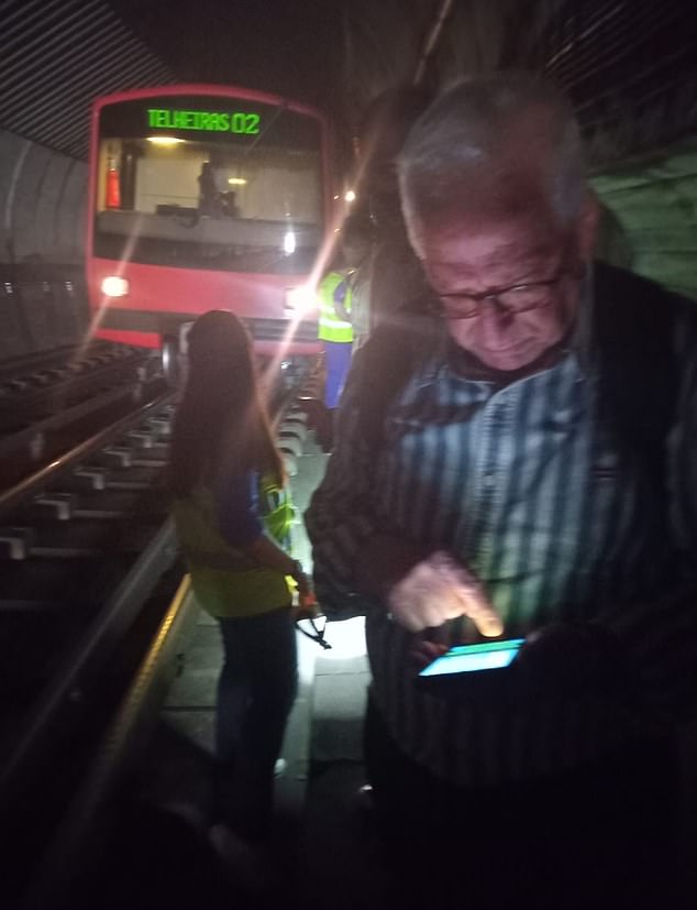Pictures from Lisbon's metro system show travellers attempting to use their phones and staff with torches