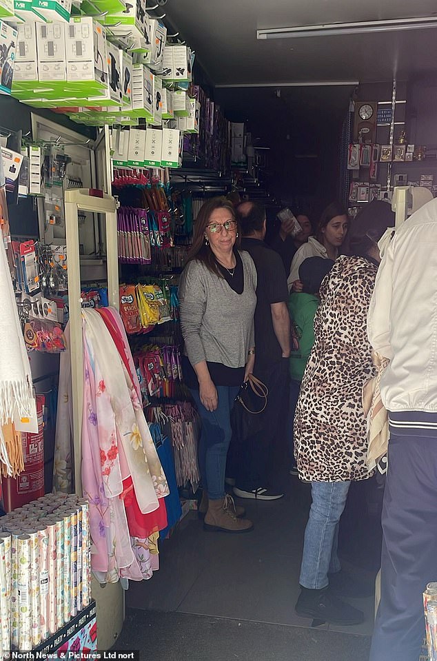 People queuing for candles in a shop Residents in Portugal and Spain have been hit with huge power cuts