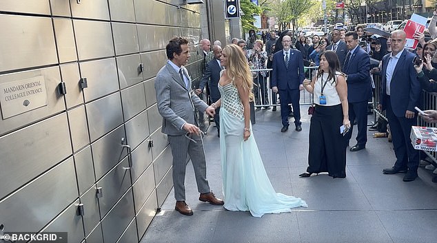 Blake was seen grabbing Ryan's hand as he tried to walk off to chat with fans