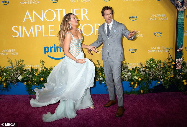 In a candid video from the red carpet Lively was filmed frantically gesturing with her hand as a puzzled Reynolds by her side widened his eyes comically before walking off