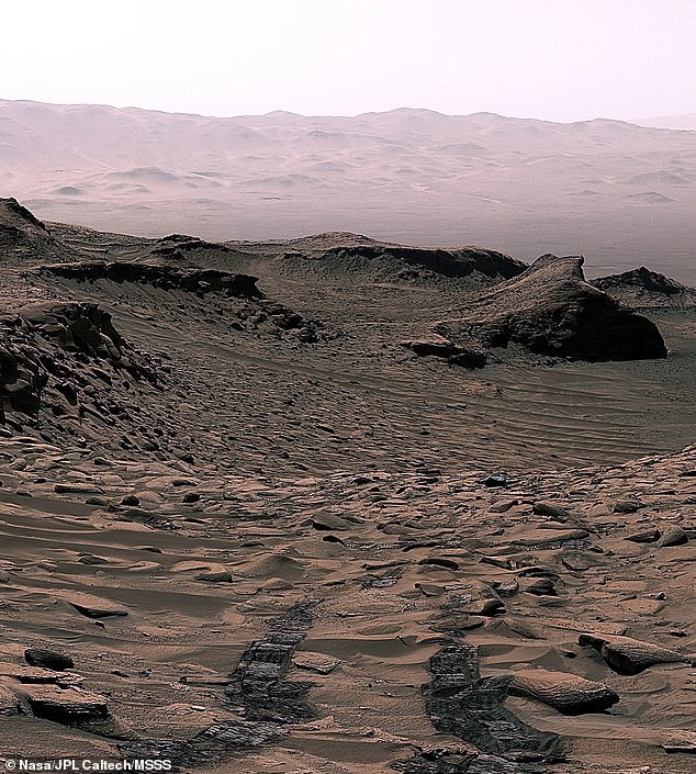NASA’s Curiosity Mars rover sees its tracks receding into the distance at the 'Ubajara' site. This site is where the rover made the siderite, a mineral that may help explain the fate of the planet’s thicker ancient atmosphere.